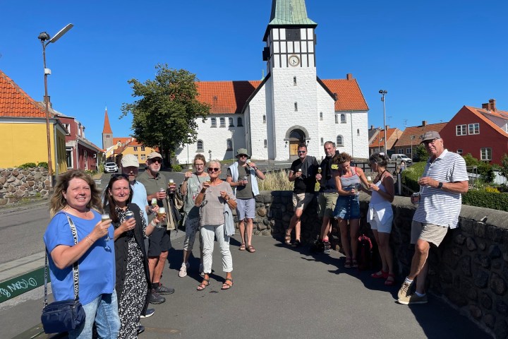a group of people standing in front of a building
