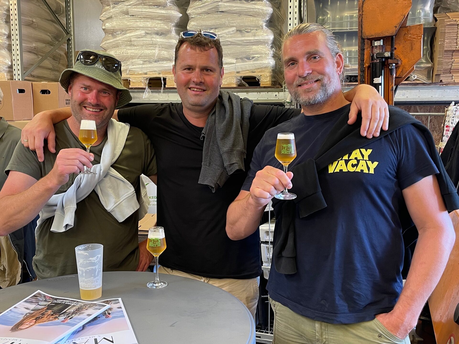 a group of people standing around a table