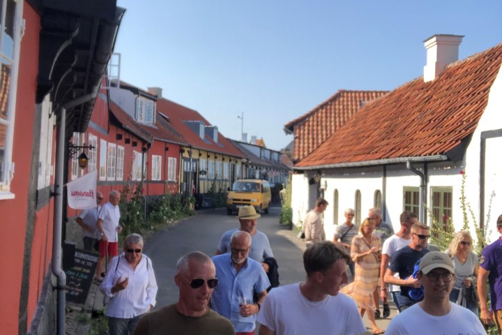 a group of people standing in front of a crowd