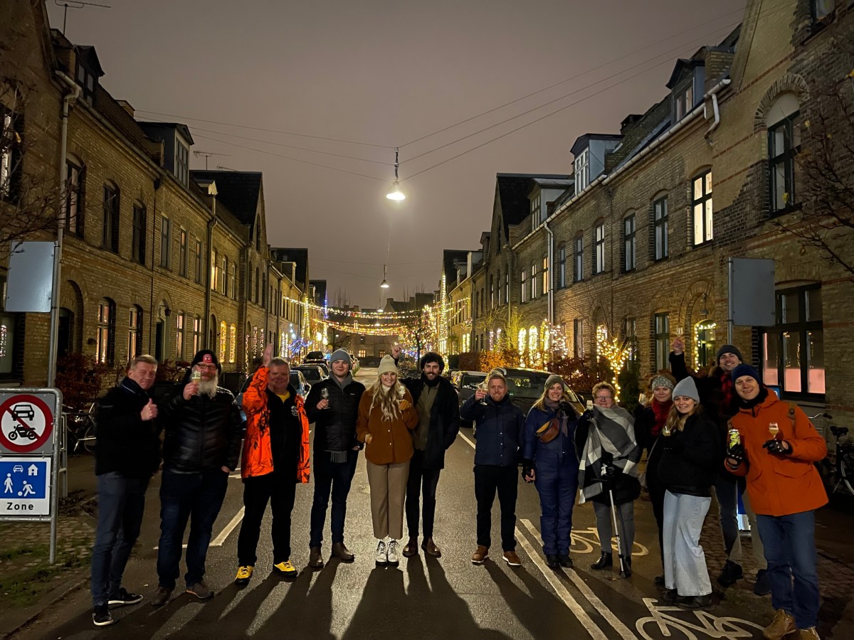 a group of people walking down a street