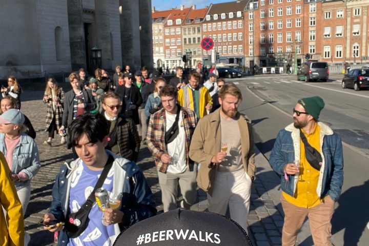 a group of people standing in front of a building