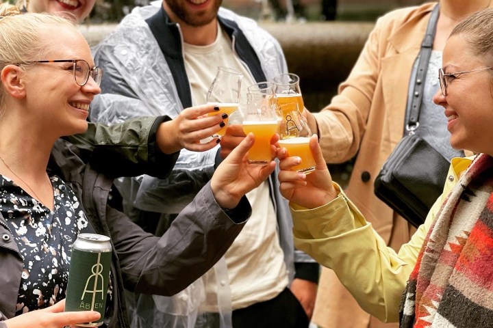 a group of people holding wine glasses