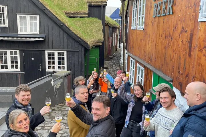 a group of people standing in front of a building