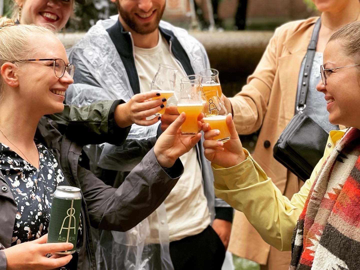 a group of people holding wine glasses