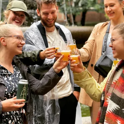 a group of people holding wine glasses
