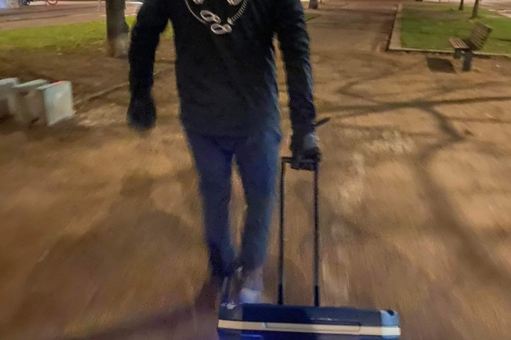 a man riding a skateboard down a street