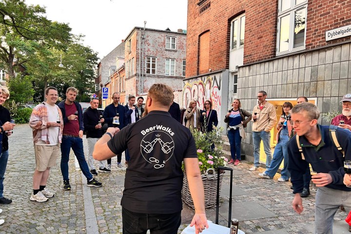a group of people walking down a street