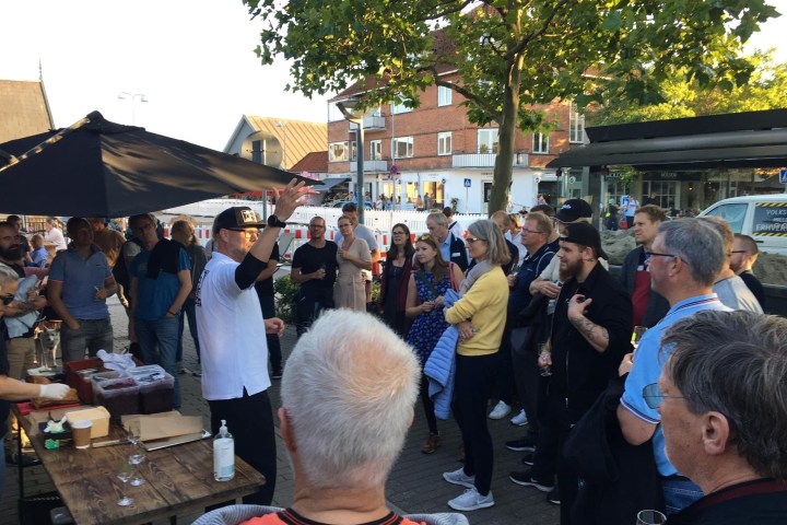 a group of people standing in front of a crowd