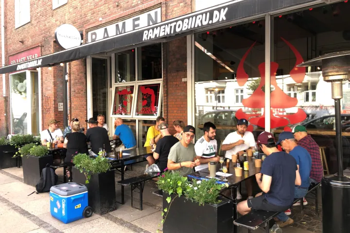 a group of people standing in front of a building
