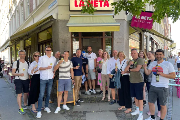 a group of people standing in front of a building