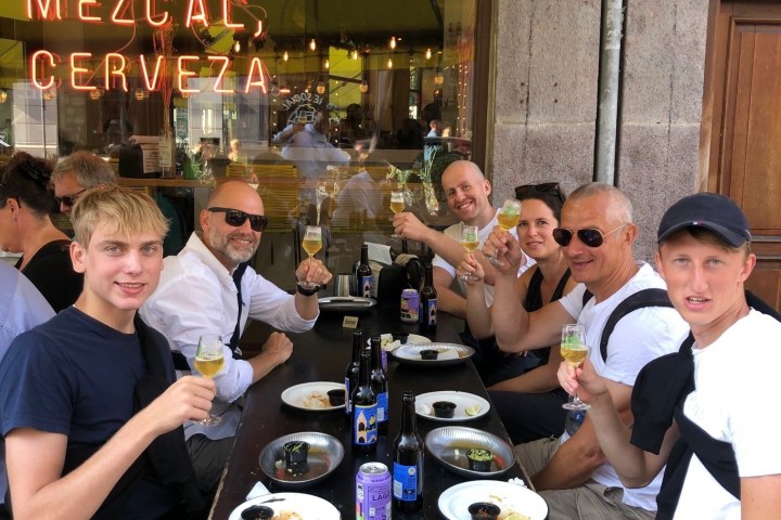 a group of people sitting at a table in a restaurant
