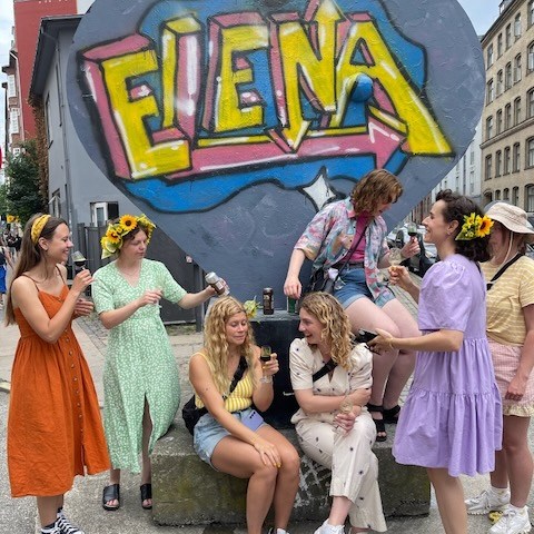 a group of people standing in front of a building
